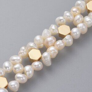 Beautiful two row natural fresh water cultured pearl bracelet + extender chain.